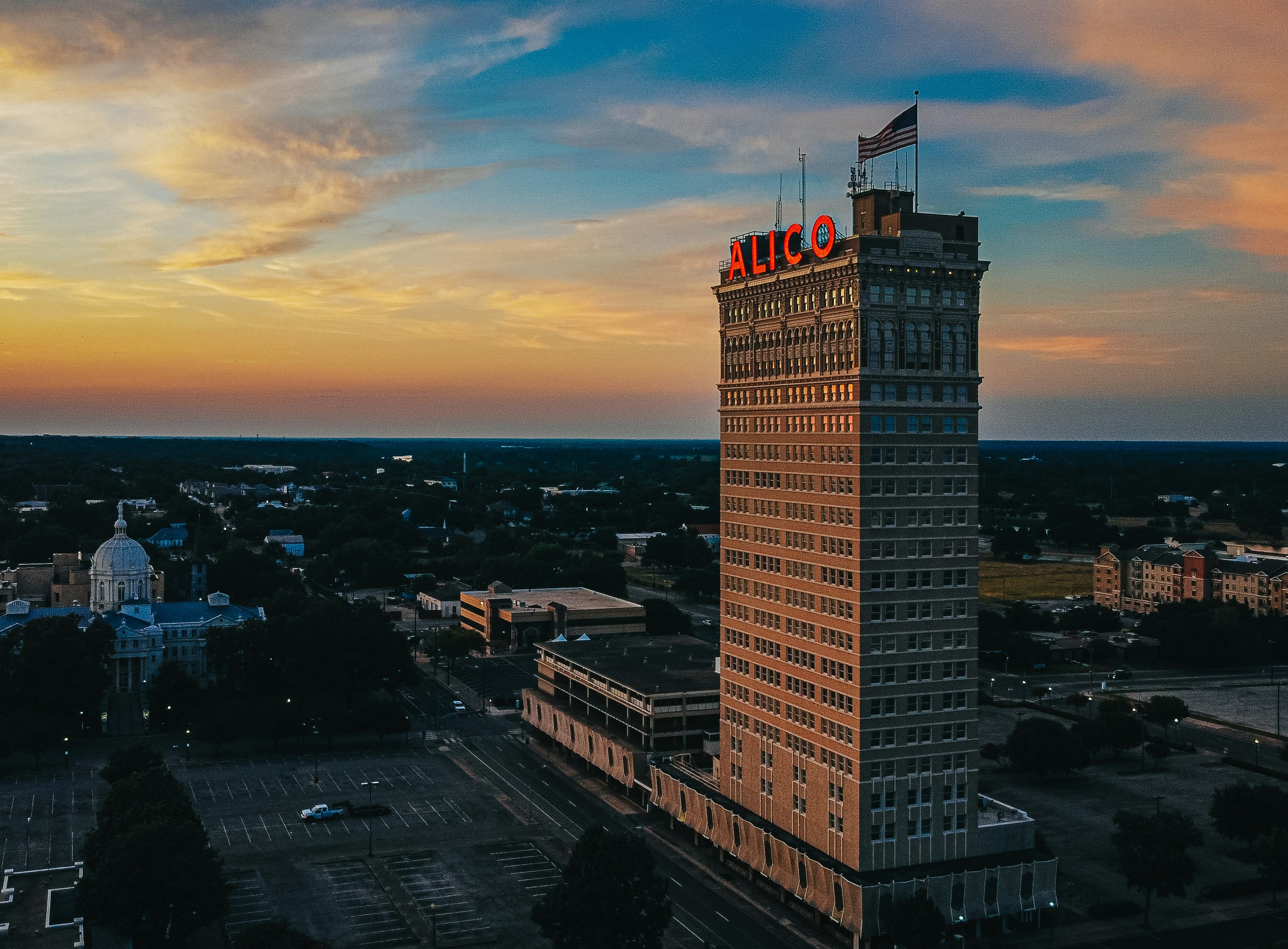 white concrete building during sunset